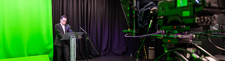 Man giving a speech on camera
