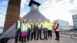 A view of Springfield Campus from the roof, students in high-vis jackets standing together