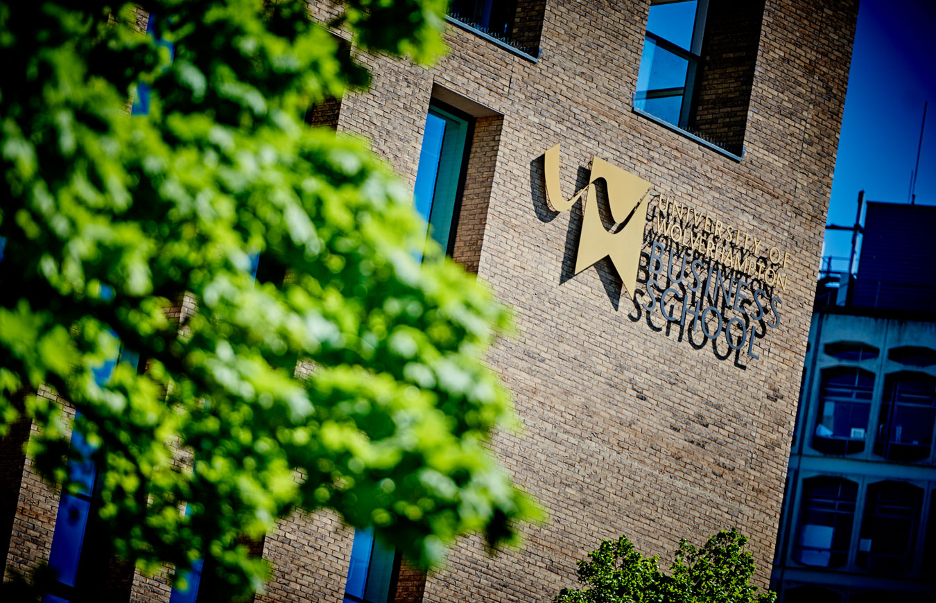 The Lord Swraj Paul building, a sign with University of Wolverhampton branding on the side of the building, with text reading University of Wolverhampton Business School