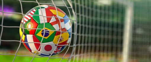 Ball with country flags hitting the back of a goal net