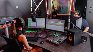 Students using the recording in the radio studio