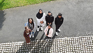 Students standing outside the entrance to the School of Art