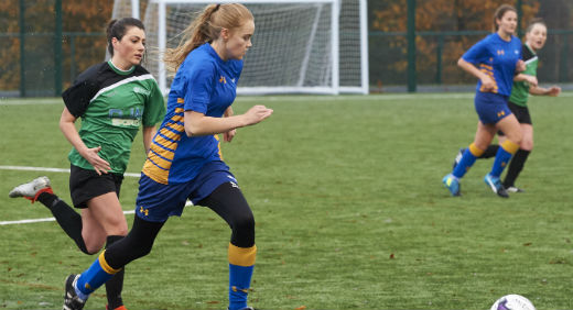 A group of women playing football