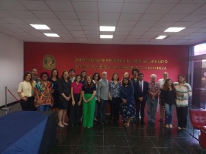 Line of DESIRE contributors in front of signage for the Universidade Federale Do Rio De Janeiro