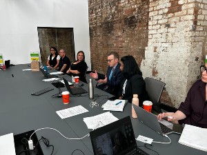 A DESIRE project discussion in progress, with participants sat around a table