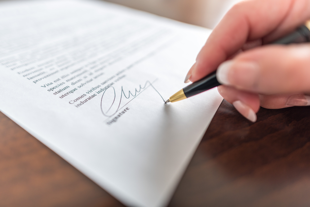 A letter being signed