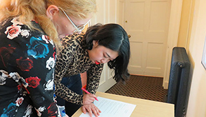 International Academy staff with student