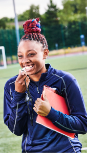 Student smiling in sport environment