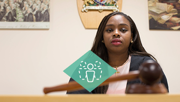 A student in a mock courtroom