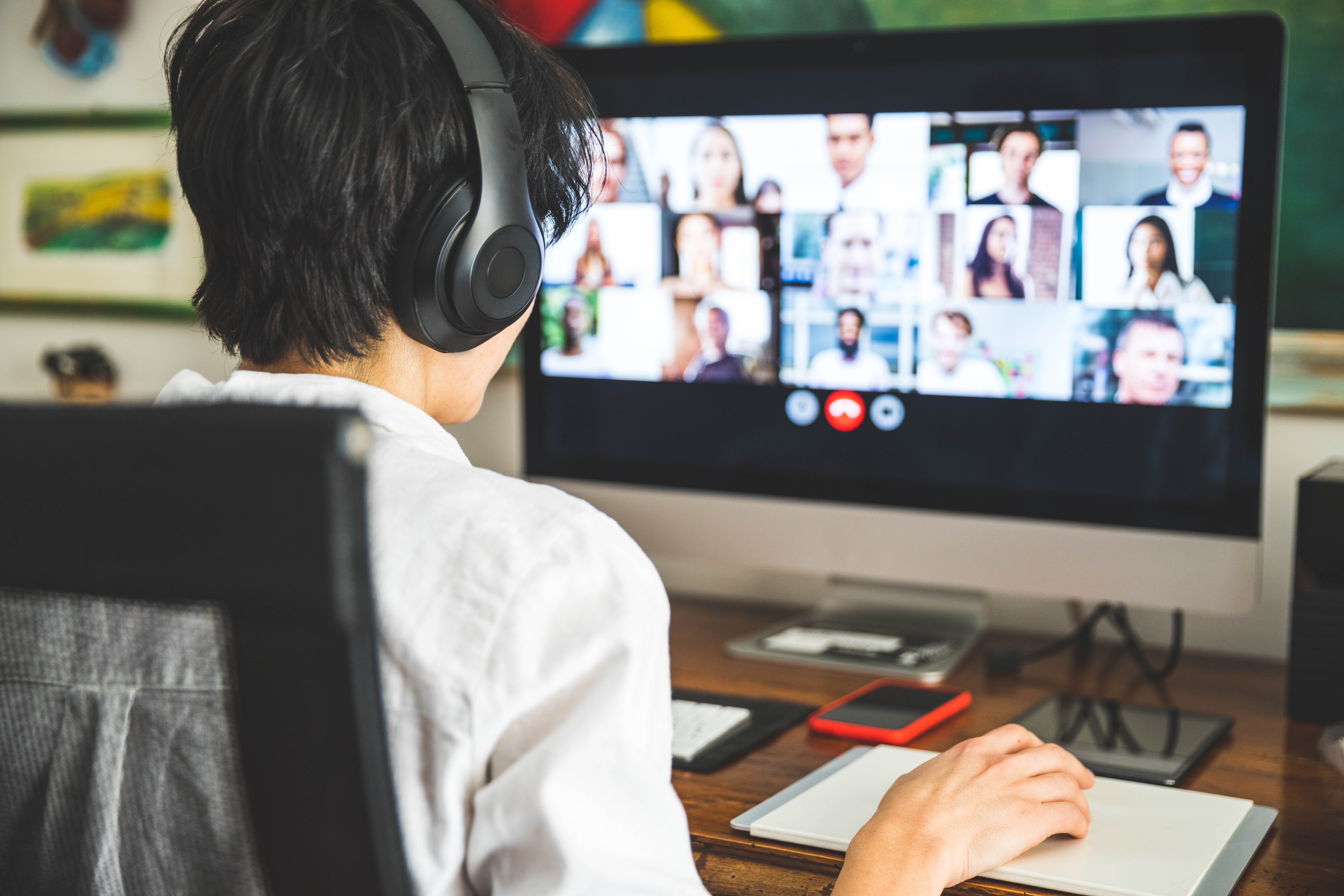 Student sitting at computer on Zoom or Teams