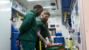 Paramedic student and paramedic in ambulance