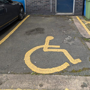 A photograph of a disabled parking space on our campus