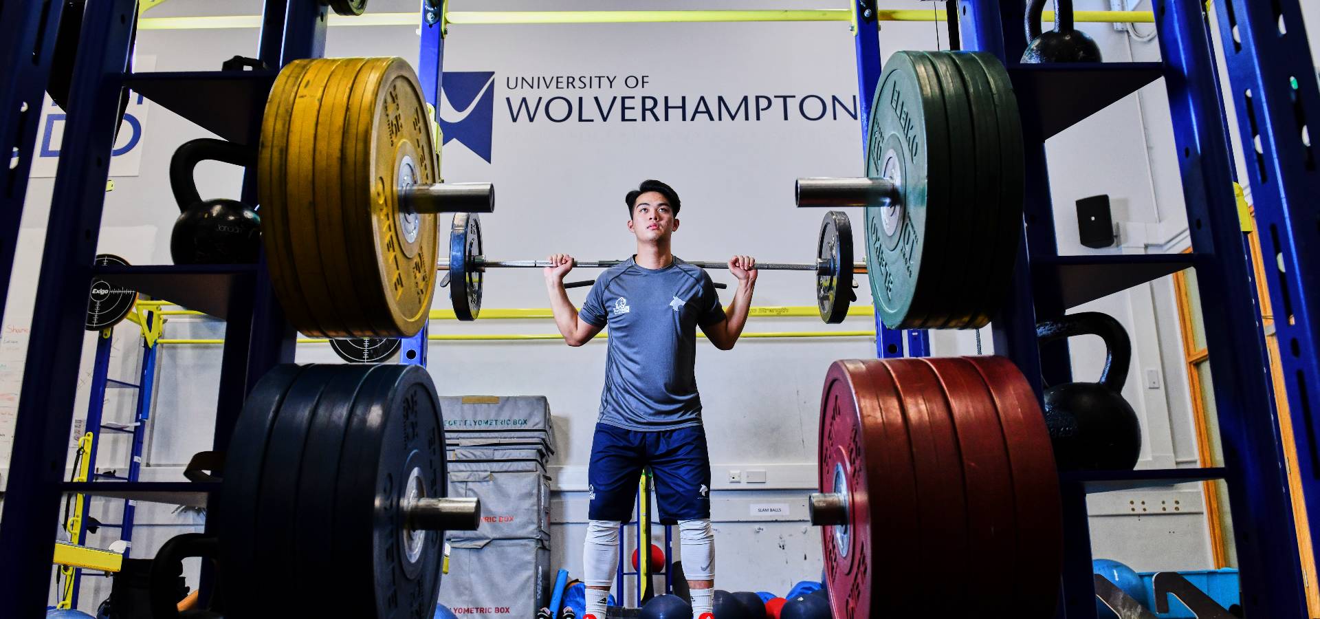 Student lifting weights