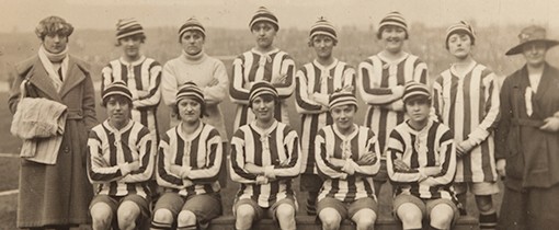 A black and white photo of a football team